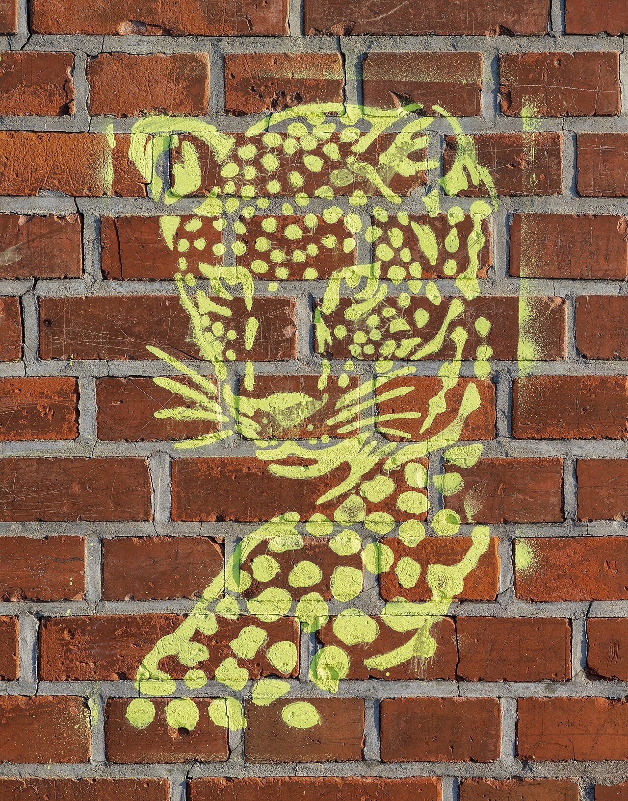 Stencil graffiti showing a stylized leopard at the southern wall of the cemetery of Böckingen, Heilbronn, Germany.
